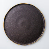 Charger plate. Rustic, yet chic and fancy dinnerware collection. Gold rim on the edge of each plate enhances irregularity of the shape and the organicity of the material.