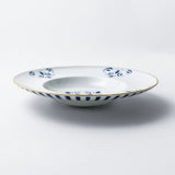 Soup plate. Pasta bowl. Exquisite dinnerware set with blue patterns and gold rim.