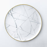 Dinner plate. Elegant and classic dinnerware collection inspired by marble and decorated with gold. Timeless dinner plate design for your table.