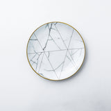Bread and butter plate. Elegant and classic dinnerware collection inspired by marble and decorated with gold. Timeless dinner plate design for your table.