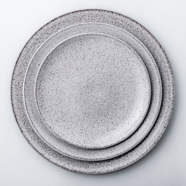 Stoneware dinnerware collection with natural glaze. An informal yet eclectic stoneware plates will add a hand-crafted look to each dinner table.