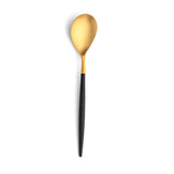Table spoon. Sleek, luxurious and modern cutlery pieces. Gold plated stainless steel with subtle design of resin handle