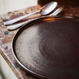 Stoneware dinner set with metallic radiance.