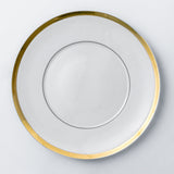 Dinner plate. Elegant and luxurious white dinnerware set with gold rim.