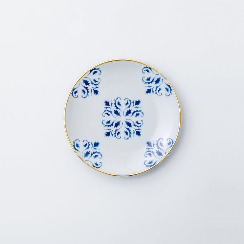 Bread and butter plate. Exquisite dinnerware set with blue patterns and gold rim.