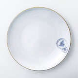 Dinner plate. Exquisite dinnerware set with blue patterns and gold rim.