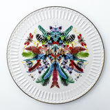 Charger plate. Modern and vibrant dinnerware set with tropical flower and fireflies motives.