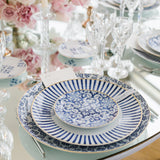 Exquisite dinnerware set with blue patterns and gold rim.